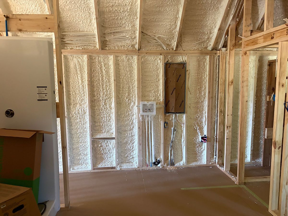 Commercial spray foam insulation on metal building ceiling